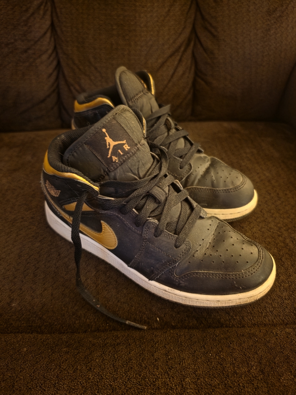 Nike Air Jordan Mid-Top Sneakers in Black and Gold